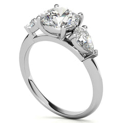 Round Brilliant and Pear Moissanite Three-Stone Ring