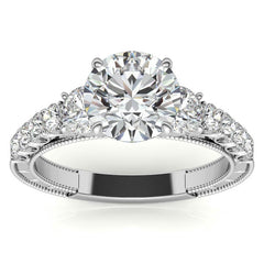 Round Brilliant Moissanite Scroll Accented Engagement Ring with Surprise Diamond