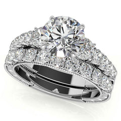 Round Brilliant Moissanite Scroll Accented Engagement Ring with Surprise Diamond