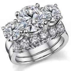 5.5ct (9.5mm,6.5mm) Round Brilliant Moissanite Three Stone Ring