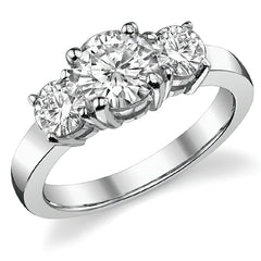 1.7ct (6.5mm,4.5mm) Round Brilliant Moissanite Three Stone Ring