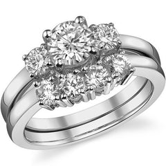 1.05ct (6mm,3.5mm) Round Brilliant Moissanite Three Stone Ring