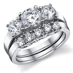 2.0ct (6.5mm,5mm) Round Brilliant Moissanite Three Stone Ring