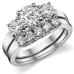 1.7ct (6.5mm,4.5mm) Round Brilliant Moissanite Three Stone Ring