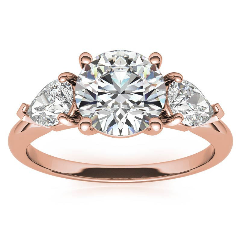 Round Brilliant and Pear Moissanite Three-Stone Ring