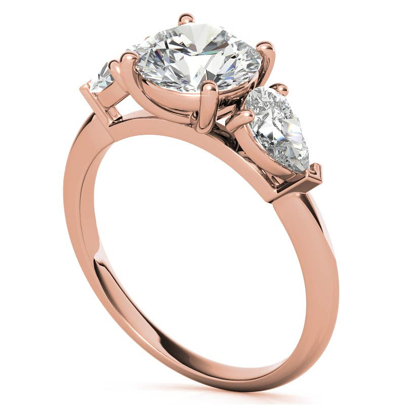 Round Brilliant and Pear Moissanite Three-Stone Ring