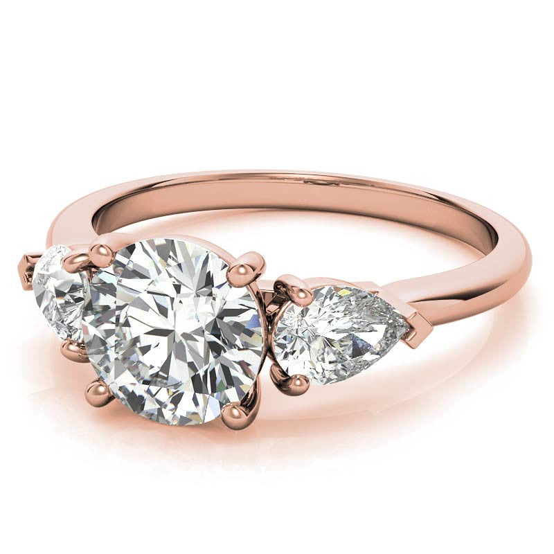 Round Brilliant and Pear Moissanite Three-Stone Ring