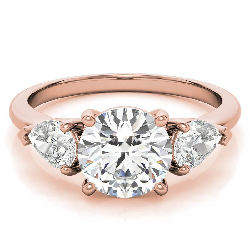 Round Brilliant and Pear Moissanite Three-Stone Ring