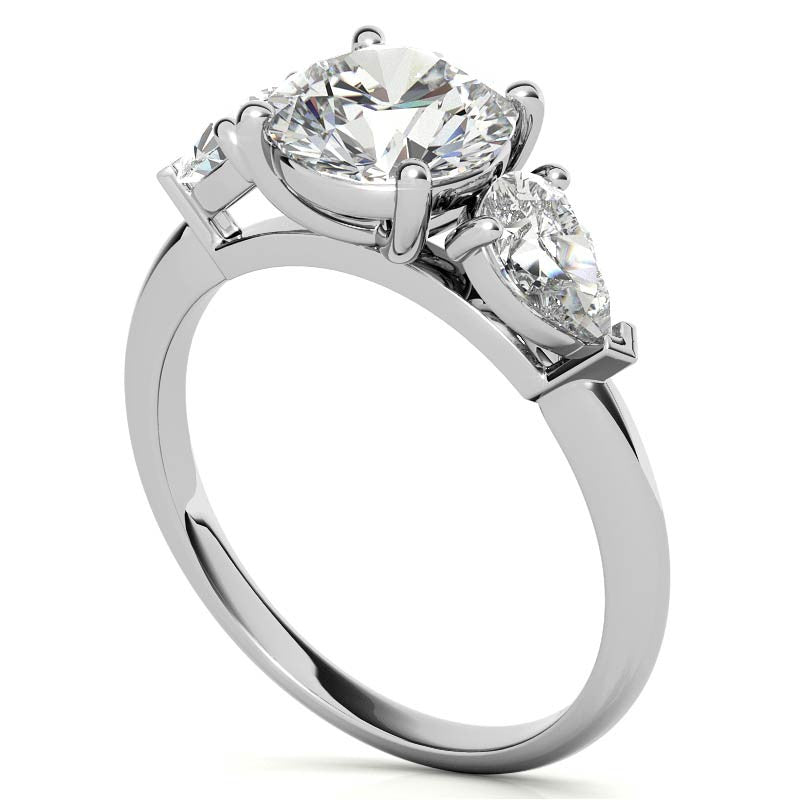 Round Brilliant and Pear Moissanite Three-Stone Ring