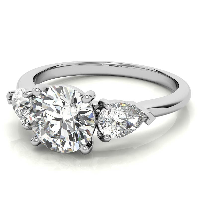 Round Brilliant and Pear Moissanite Three-Stone Ring