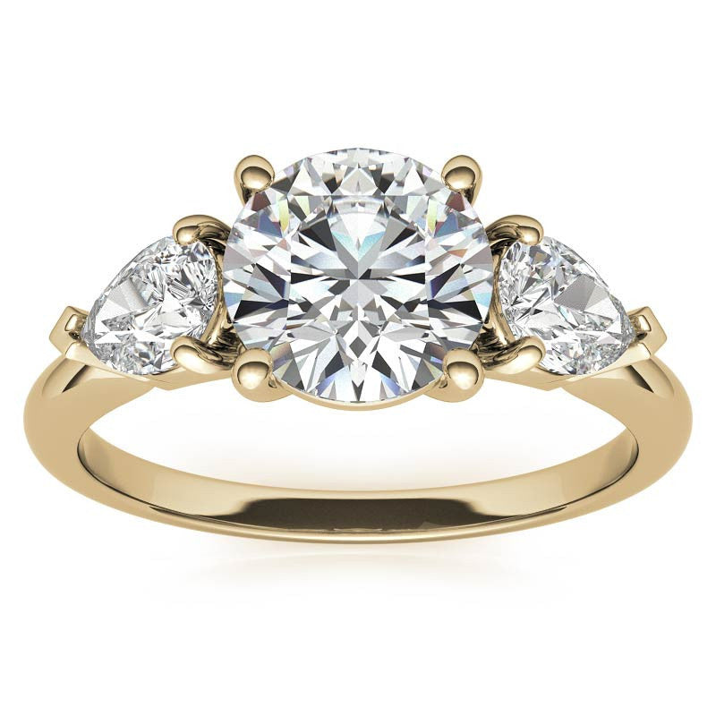 Round Brilliant and Pear Moissanite Three-Stone Ring