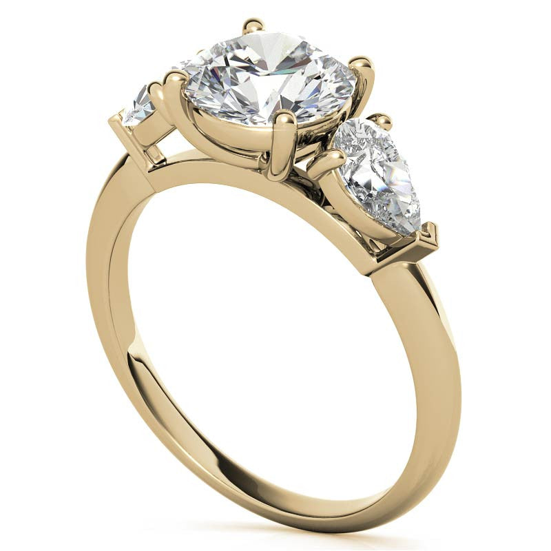 Round Brilliant and Pear Moissanite Three-Stone Ring