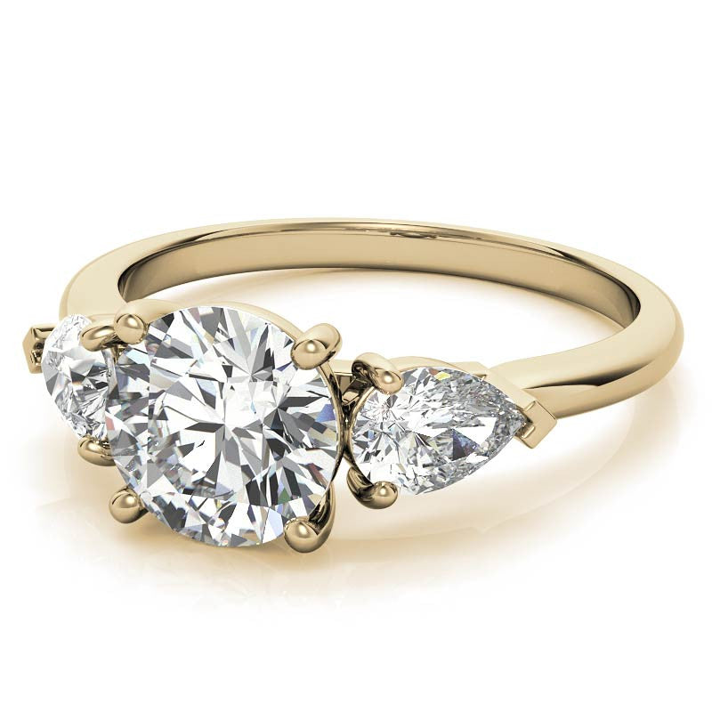 Round Brilliant and Pear Moissanite Three-Stone Ring