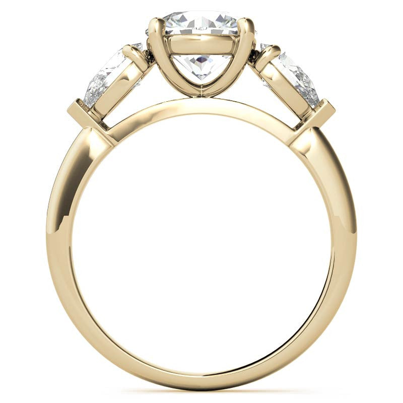 Round Brilliant and Pear Moissanite Three-Stone Ring