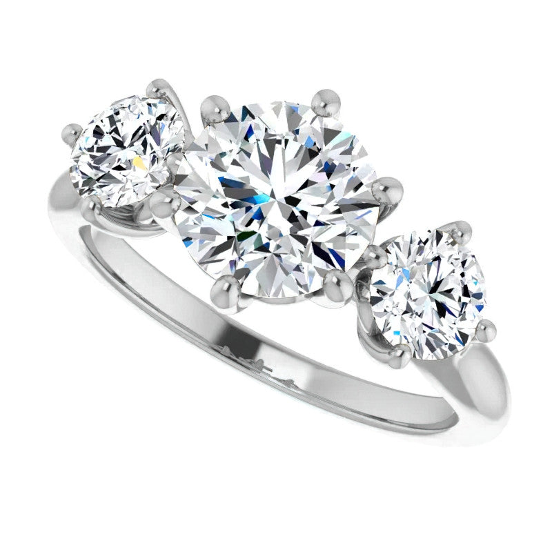 Round Brilliant Moissanite Heart Accented Three-Stone Ring
