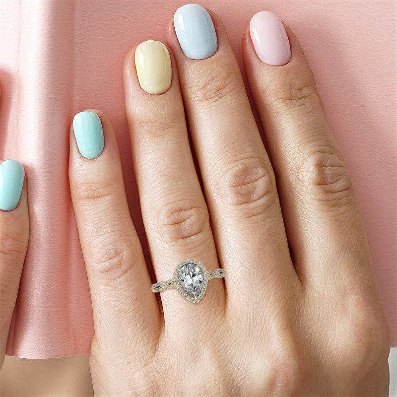 Pear Twisted Cathedral Halo Engagement Ring