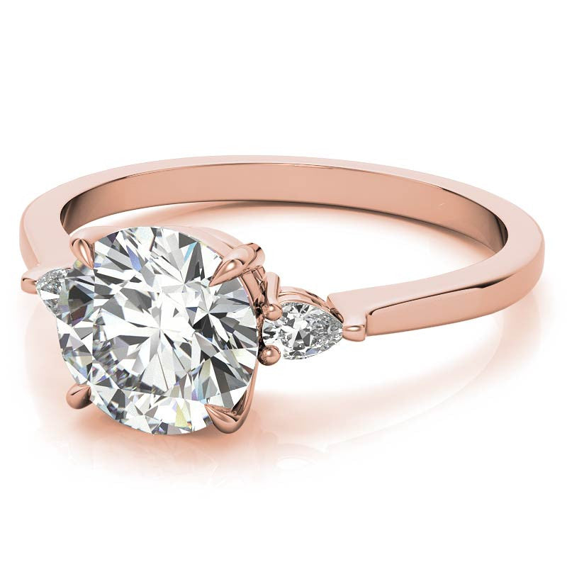 Round Brilliant Moissanite and Diamond Pear 3-Stone Engagement Ring