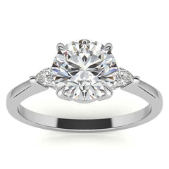 Round Brilliant Moissanite and Diamond Pear 3-Stone Engagement Ring