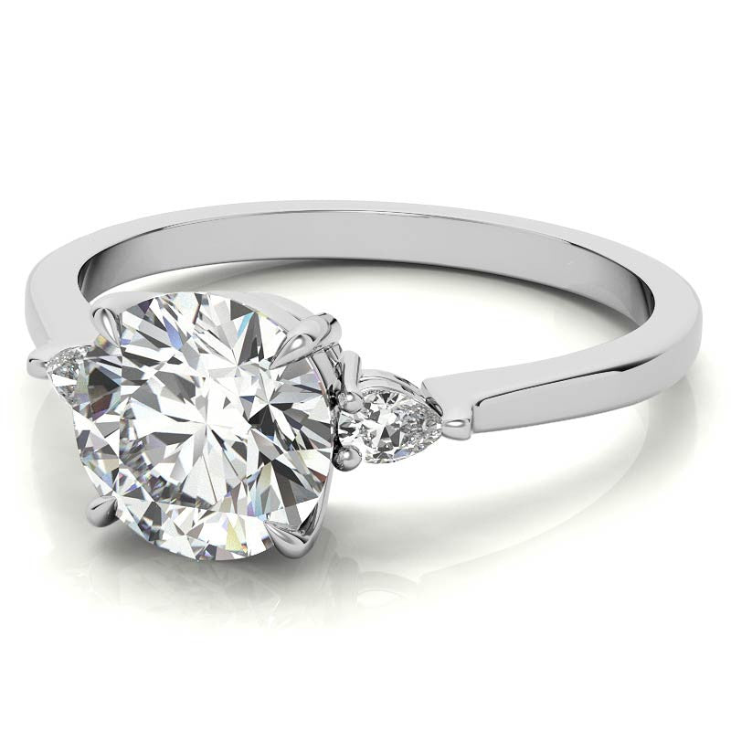 Round Brilliant Moissanite and Diamond Pear 3-Stone Engagement Ring