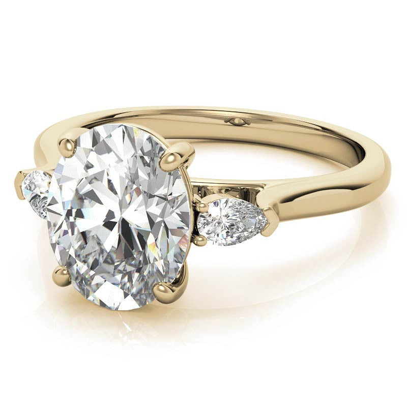 Oval and Pear Three-Stone Moissanite Engagement Ring