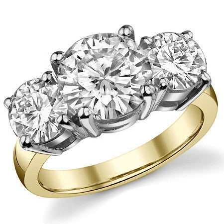 5.0ct (9.0mm,6.5mm) Round Brilliant Moissanite Three Stone Ring