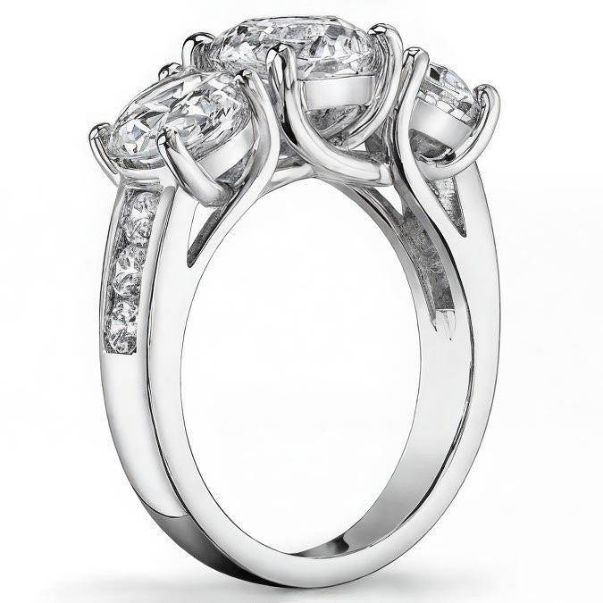 3.3ct (7.5mm/6mm) Round Brilliant Moissanite Trellis Three-Stone Ring