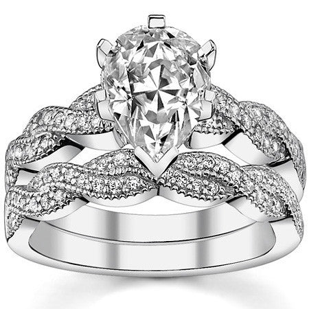 Round Brilliant Moissanite & Diamond Twisted Milgrain Engagement Ring