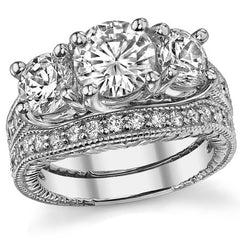 2.9ct (7mm,6mm) Round Brilliant Moissanite Antique Trellis 3-Stone Ring
