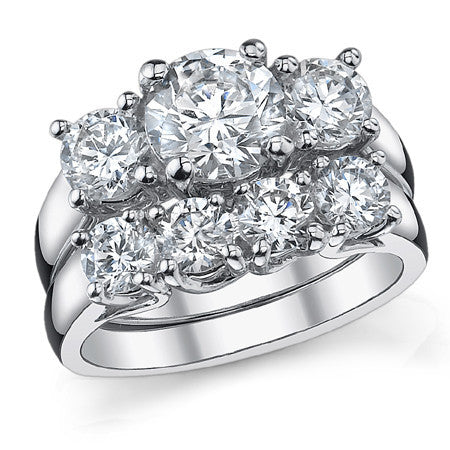 2.25ct (7mm/5mm) Round Brilliant Moissanite Trellis 3 Stone Ring