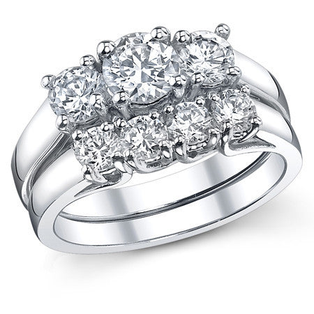0.8ct (5mm/3.5mm) Round Brilliant Moissanite Trellis 3 Stone Ring