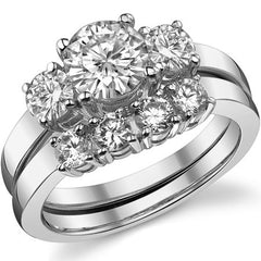 1.5ct (6.5mm,4mm) Round Brilliant Moissanite Three Stone Ring