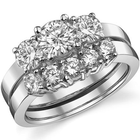 1.4ct (6mm,4.5mm) Round Brilliant Moissanite Three Stone Ring