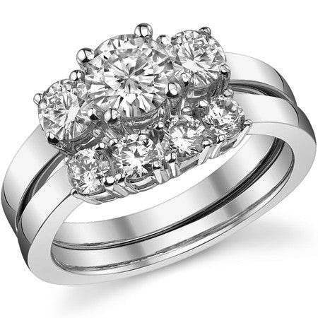 1.25ct (6mm,4mm) Round Brilliant Moissanite Three Stone Ring