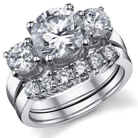 5.0ct (9.5mm,6mm) Round Brilliant Moissanite Three Stone Ring