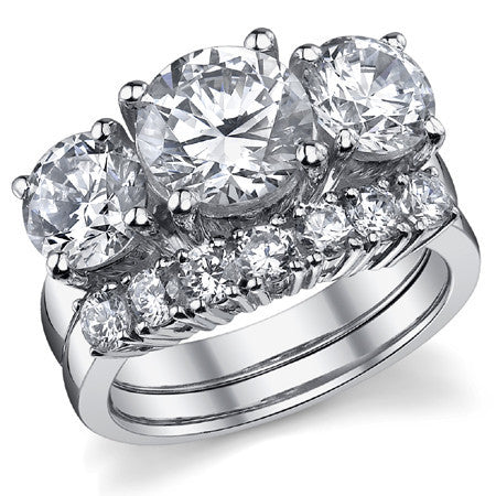 5.0ct (9.0mm,6.5mm) Round Brilliant Moissanite Three Stone Ring
