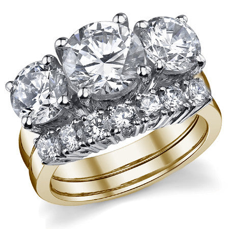 5.0ct (9.0mm,6.5mm) Round Brilliant Moissanite Three Stone Ring