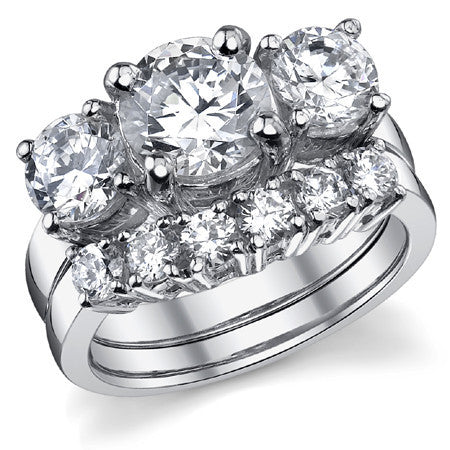 3.5ct (8mm,6.0mm) Round Brilliant Moissanite Three Stone Ring