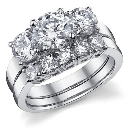 2.25ct (7mm,5mm) Round Brilliant Moissanite Three Stone Ring