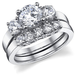1.9ct (7mm,4.5mm) Round Brilliant Moissanite Three Stone Ring