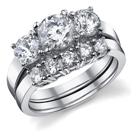 2.0ct (6.5mm,5mm) Round Brilliant Moissanite Three Stone Ring