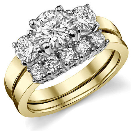 1.7ct (6.5mm,4.5mm) Round Brilliant Moissanite Three Stone Ring