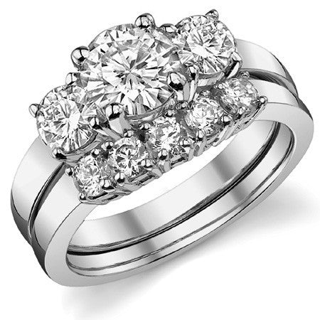 1.7ct (6.5mm,4.5mm) Round Brilliant Moissanite Three Stone Ring
