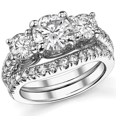 2.7ct (7.5mm/5mm) Round Brilliant Moissanite Trellis Three-Stone Ring