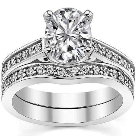 Round Brilliant Moissanite Scroll Cathedral Engagement Ring