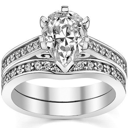 Round Brilliant Moissanite Scroll Cathedral Engagement Ring