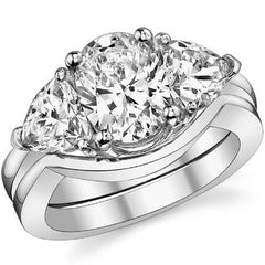 (3.85ct) 9x7mm/6mm Oval & Trillion Moissanite Three-Stone Ring